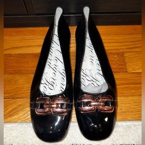 Robert Clergerie black flats with large chain buckle on toe